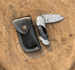 Handmade Damascus Folding Knife: Black Horn Handle, Leather Sheath I WildEdgeBlade